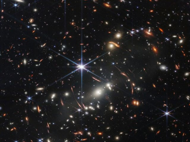 Biden unveils Webb space telescope’s first full-color image of distant galaxies